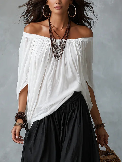 Ensemble blanc à épaules dénudées avec pantalon évasé style lanterne